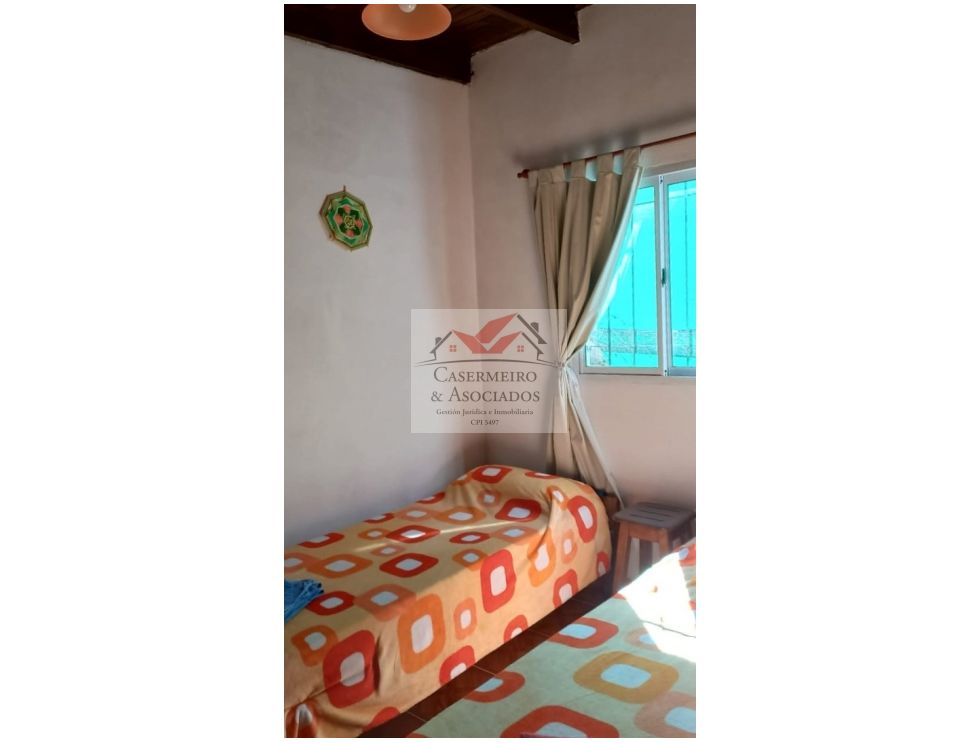 LOTE CON DOS CASAS EN ANISACATE.